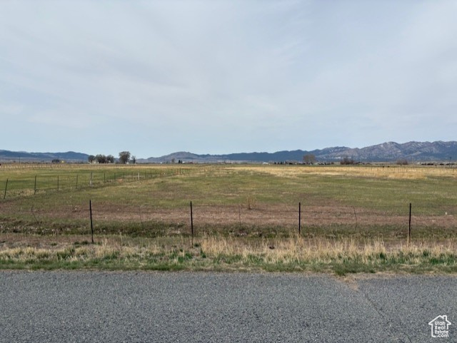Property view of mountains with a rural view