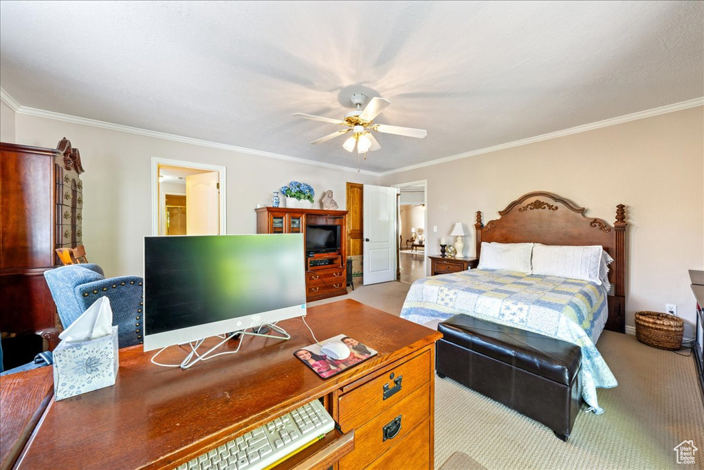Bedroom with crown molding, ceiling fan, light colored carpet, and ensuite bath