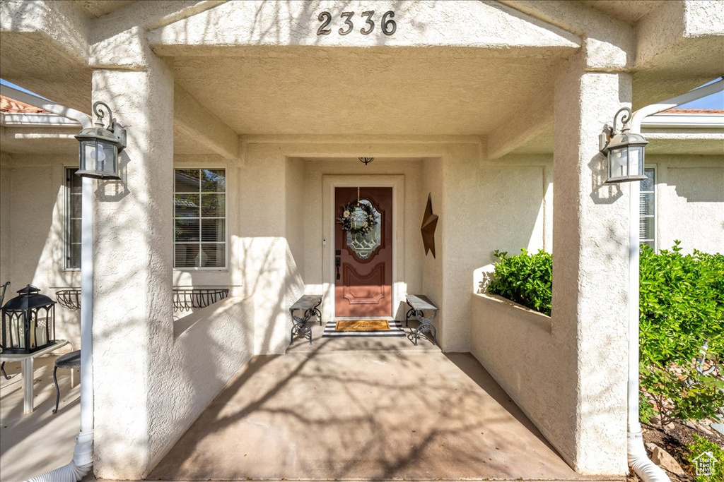 Doorway to property with stucco siding