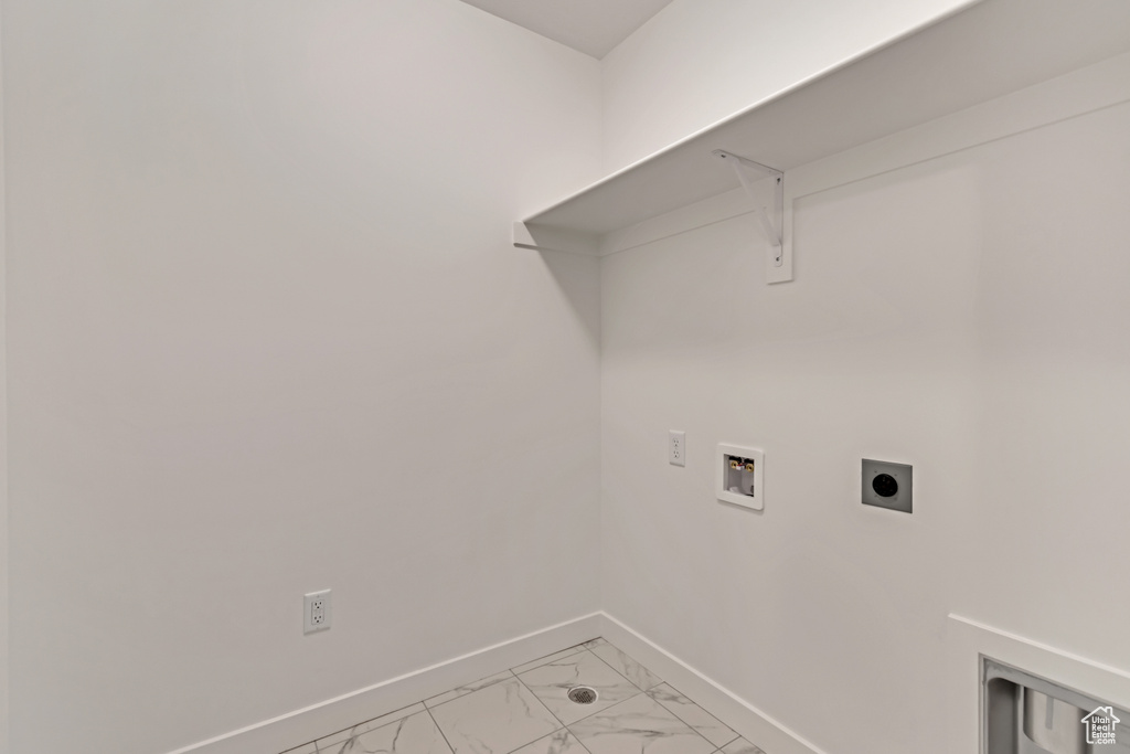 Washroom with baseboards, marble finish floor, washer hookup, laundry area, and electric dryer hookup