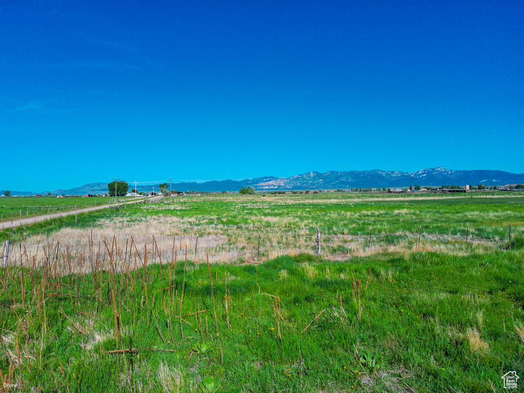 View of mountain background featuring rural landscape