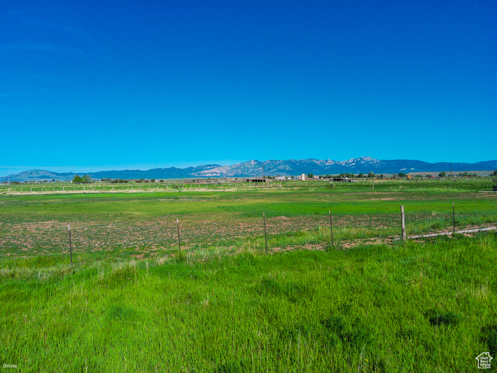 View of mountain background with rural landscape and agricultural land