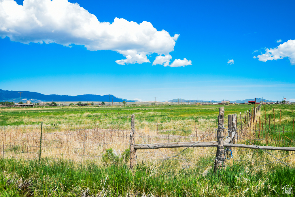 View of mountain backdrop with rural landscape