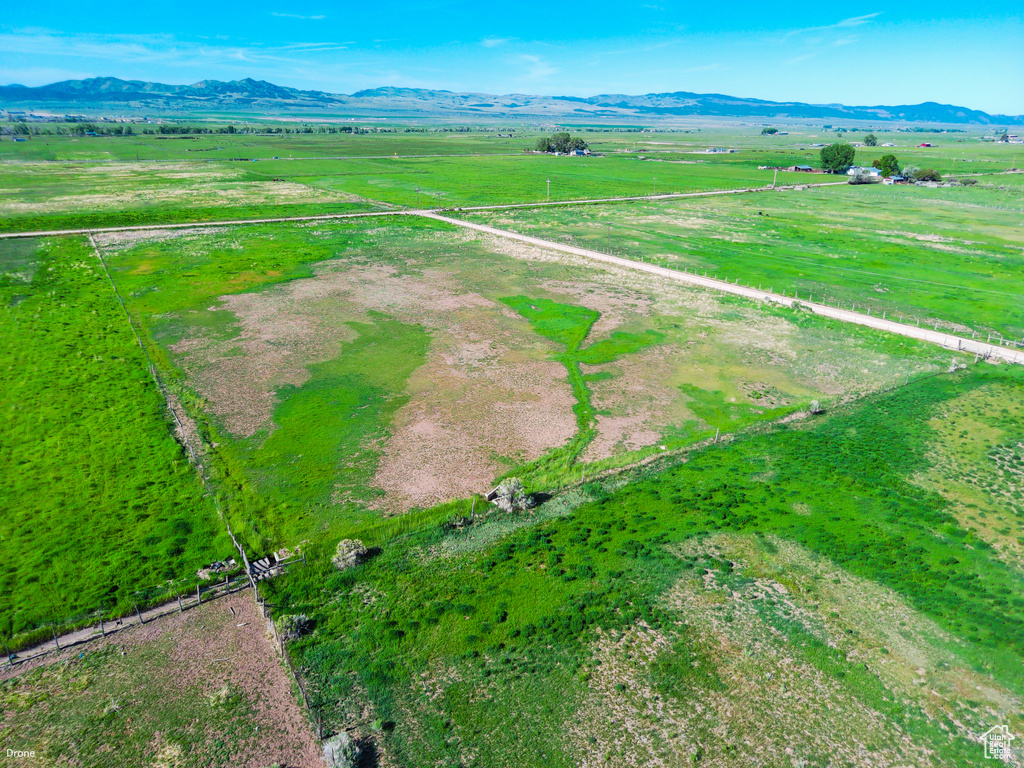 Aerial view of sparsely populated area with a mountain backdrop
