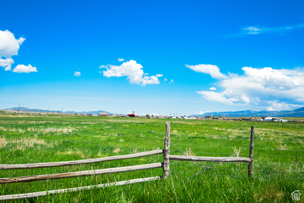 View of yard with a view of countryside and a mountain view