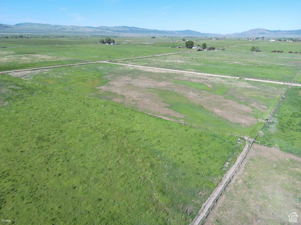 Overview of rural landscape featuring a mountain backdrop