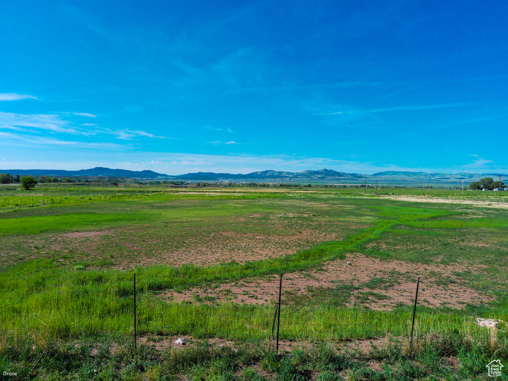View of mountain background featuring rural landscape
