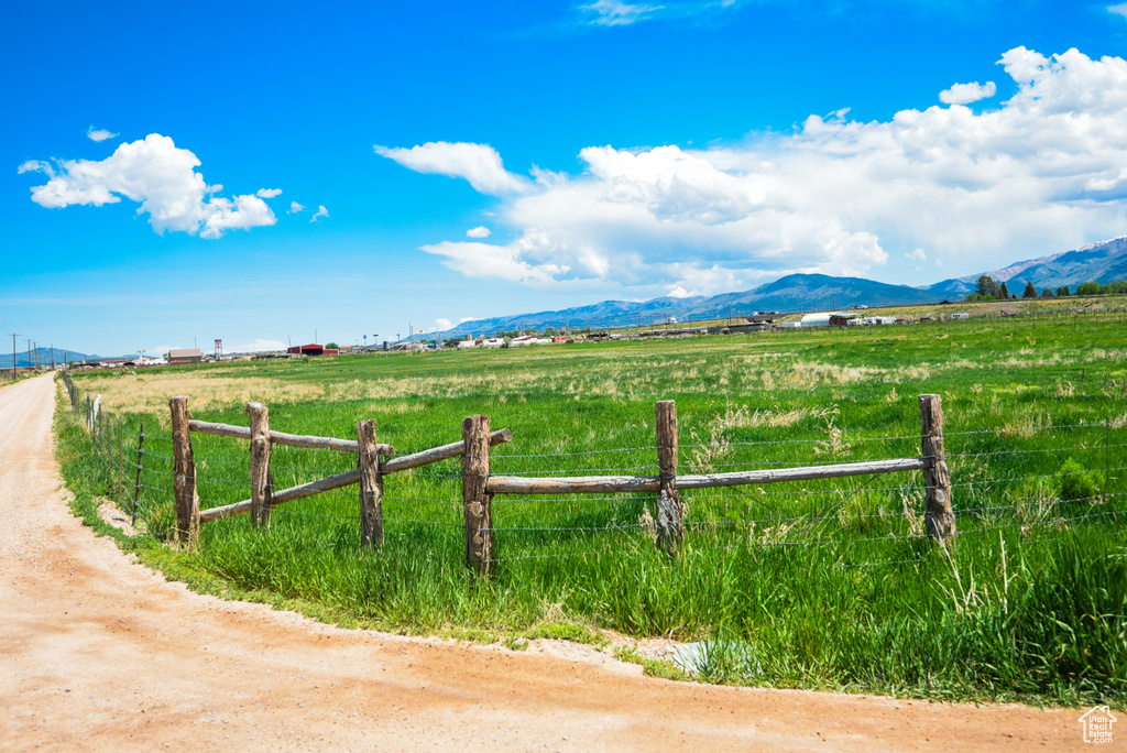 View of mountain backdrop with rural landscape and agricultural land