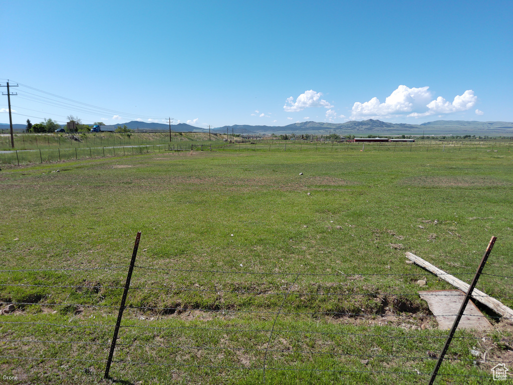 View of yard with a view of countryside and a mountain view