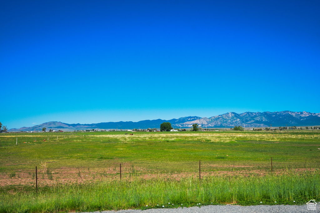 View of mountain background with rural landscape and agricultural land