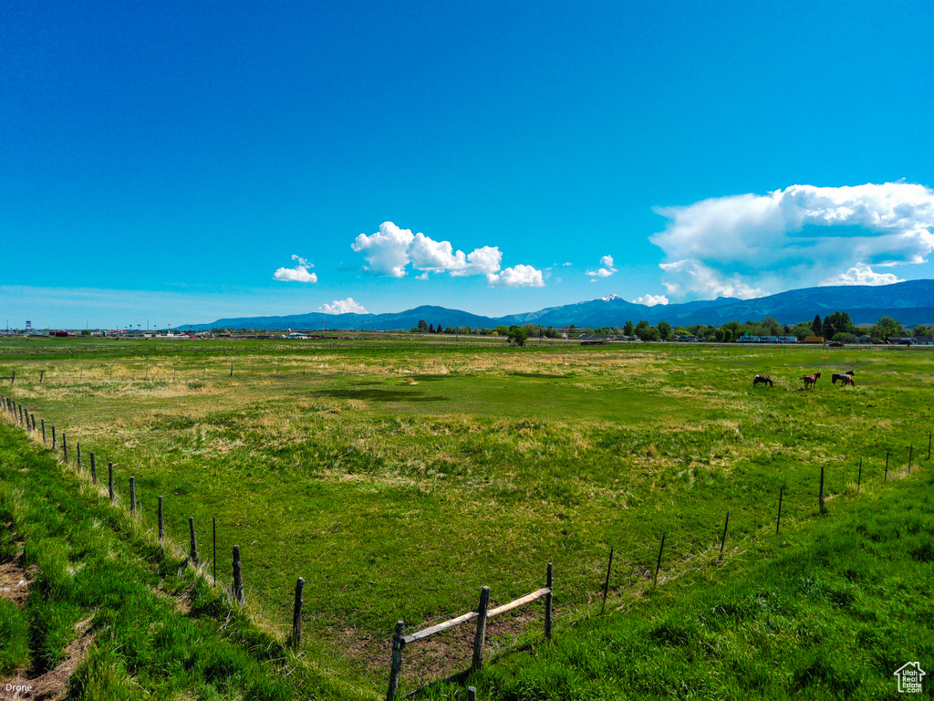 View of mountain backdrop with rural landscape and a pastoral area