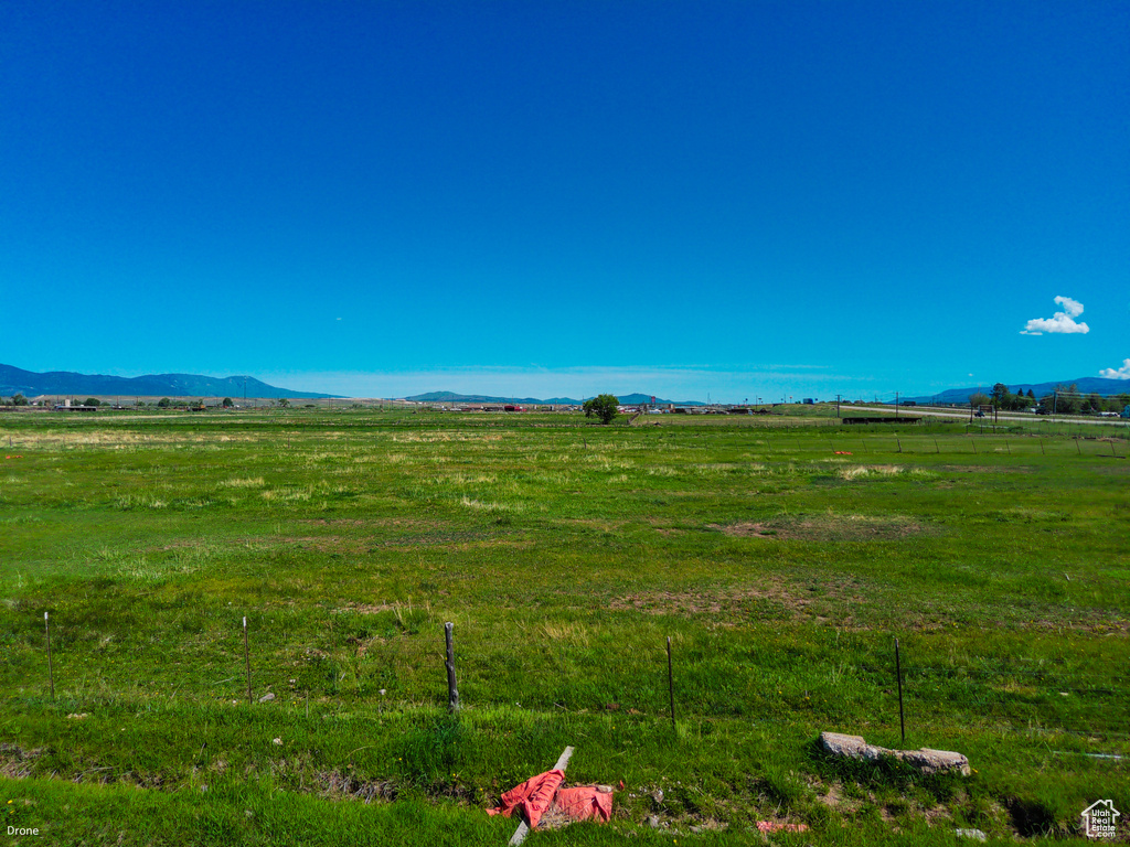 View of yard featuring a view of rural / pastoral area and a mountain view