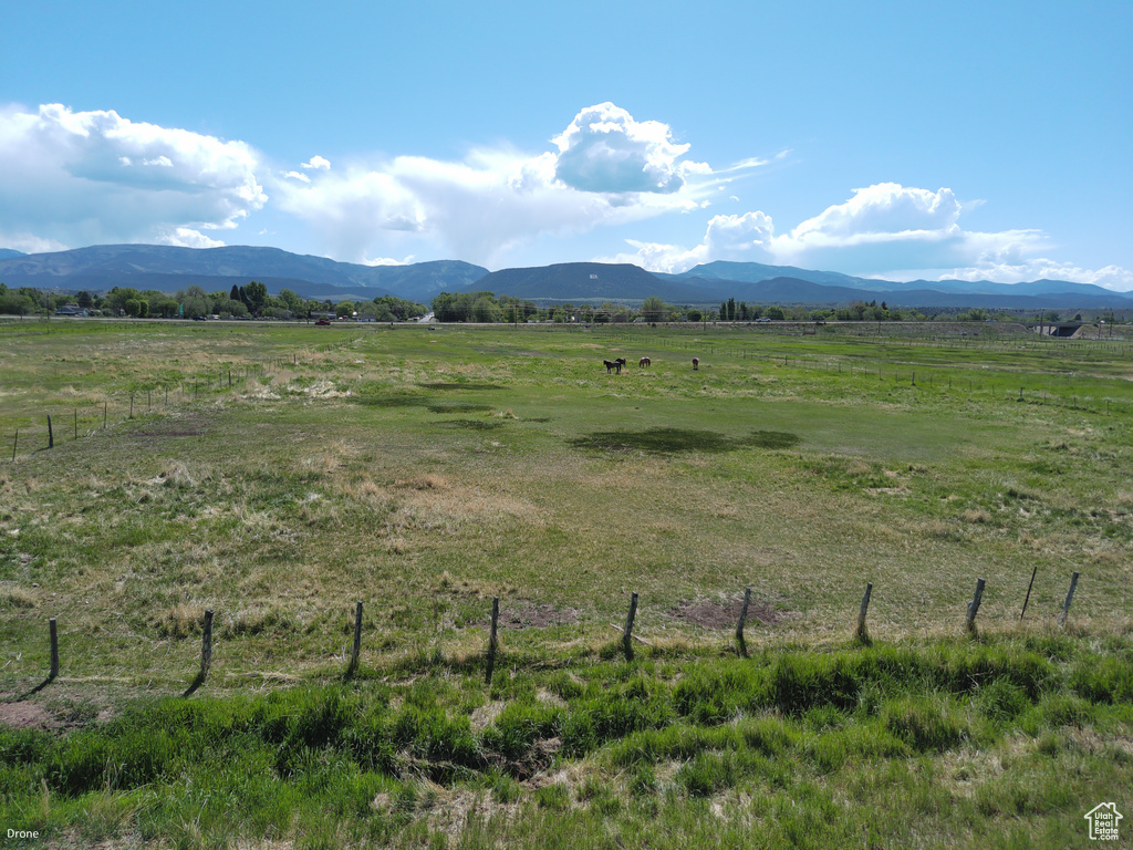 View of mountain background featuring rural landscape