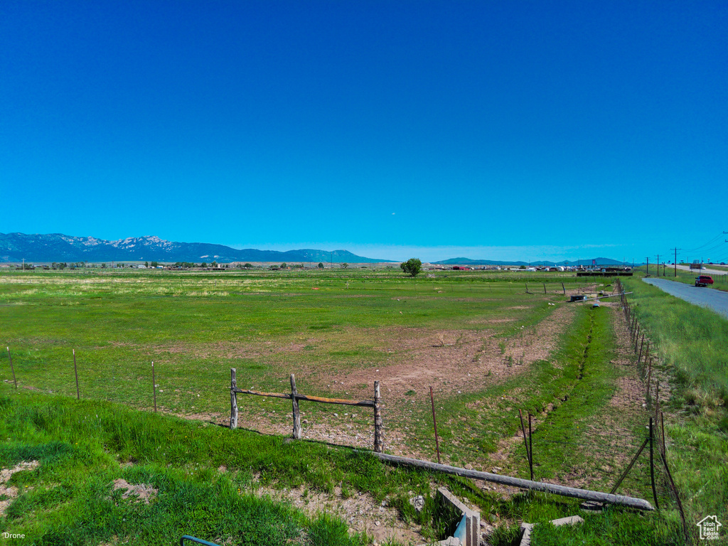 View of yard featuring a view of countryside and a mountain view