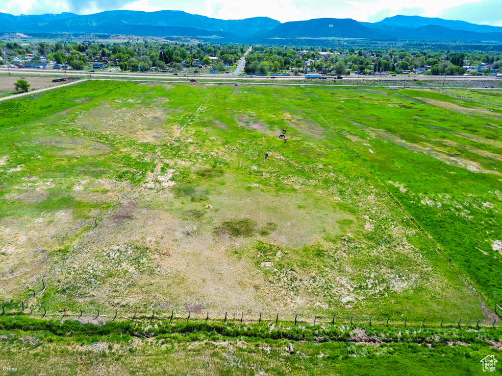 Aerial view of sparsely populated area featuring a mountain backdrop