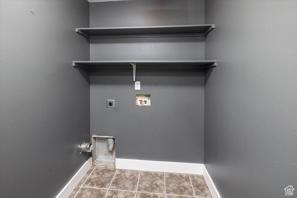 Washroom featuring baseboards, electric dryer hookup, laundry area, and hookup for a washing machine
