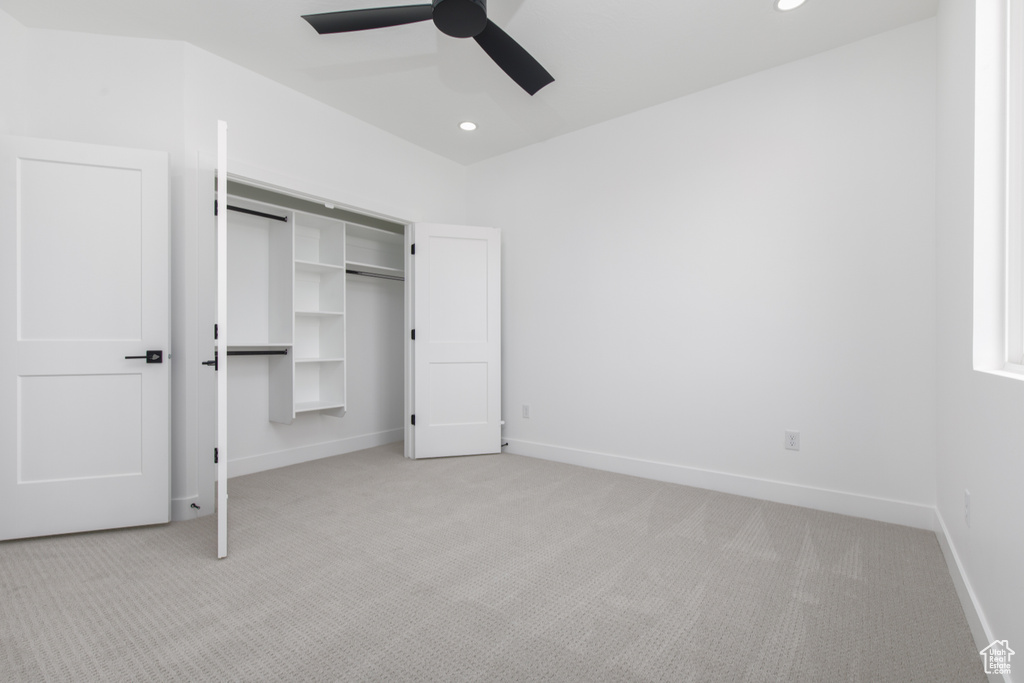 Unfurnished bedroom featuring baseboards, recessed lighting, and light carpet