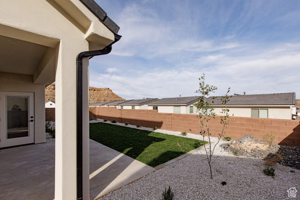 View of yard featuring a patio and a fenced backyard