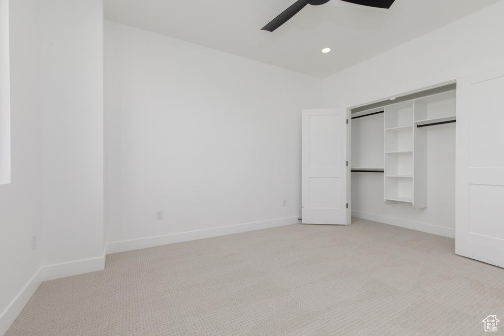 Unfurnished bedroom featuring baseboards, recessed lighting, light colored carpet, and a ceiling fan