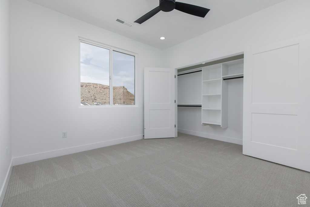 Unfurnished bedroom with visible vents, baseboards, recessed lighting, and light carpet