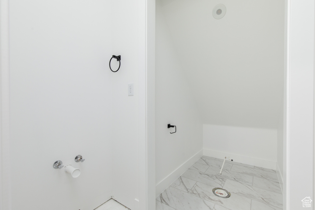 Bathroom with baseboards and marble finish floor