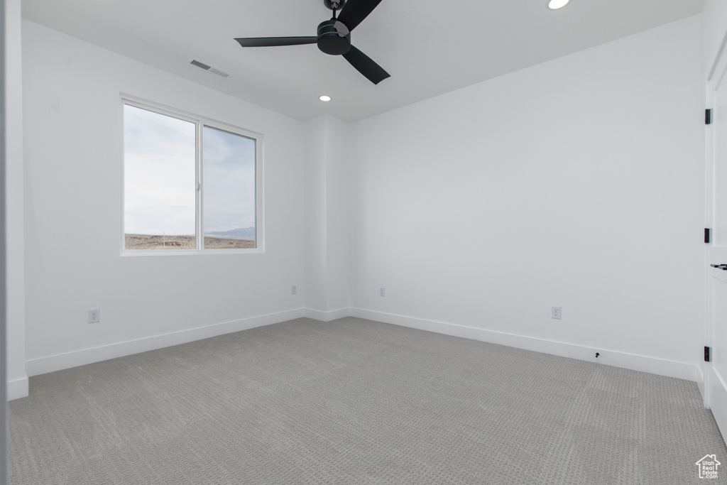 Spare room with baseboards, light carpet, recessed lighting, a ceiling fan, and visible vents