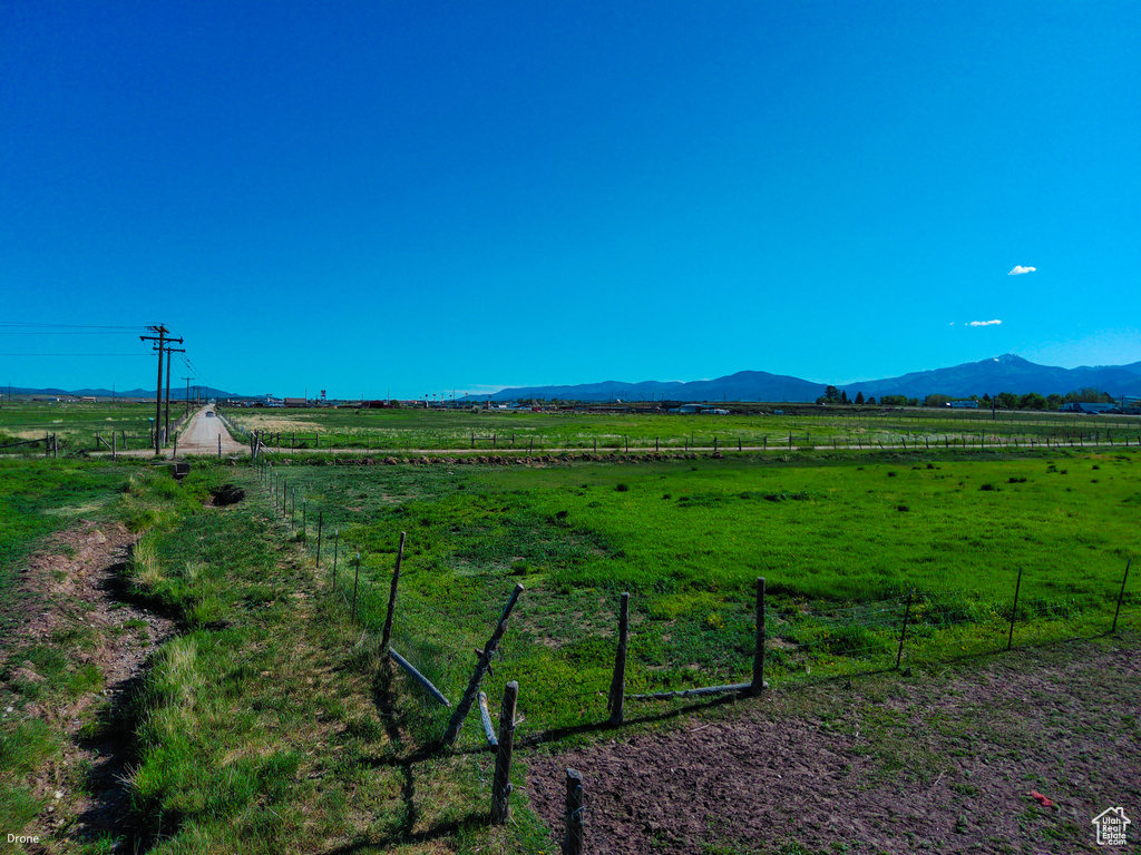 View of mountain background featuring rural landscape