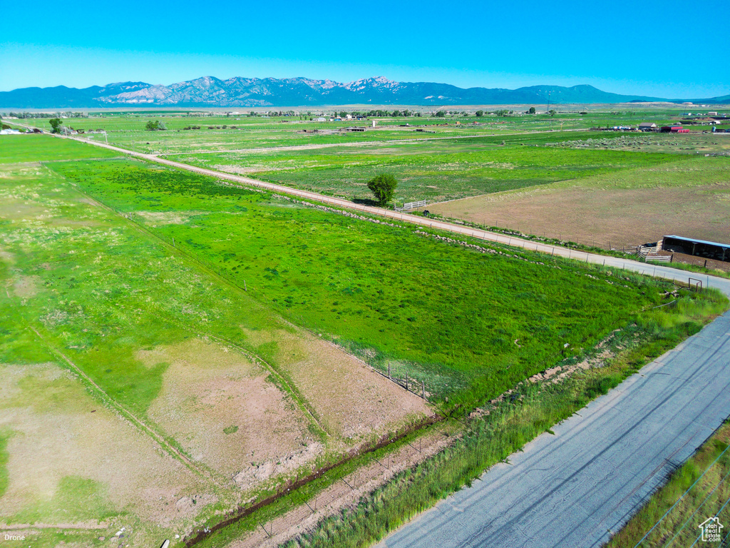 View of mountain backdrop featuring rural landscape