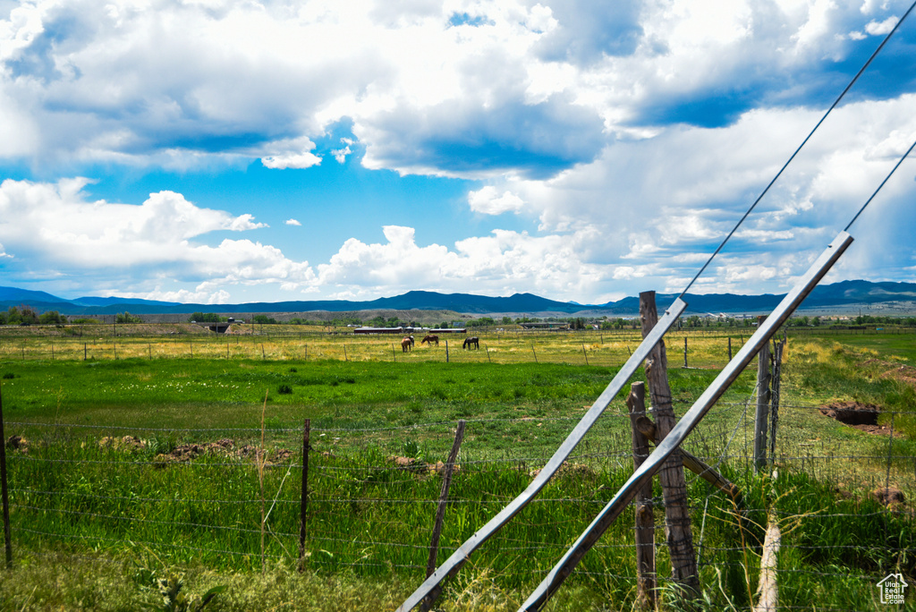 View of mountain backdrop featuring rural landscape and agricultural land