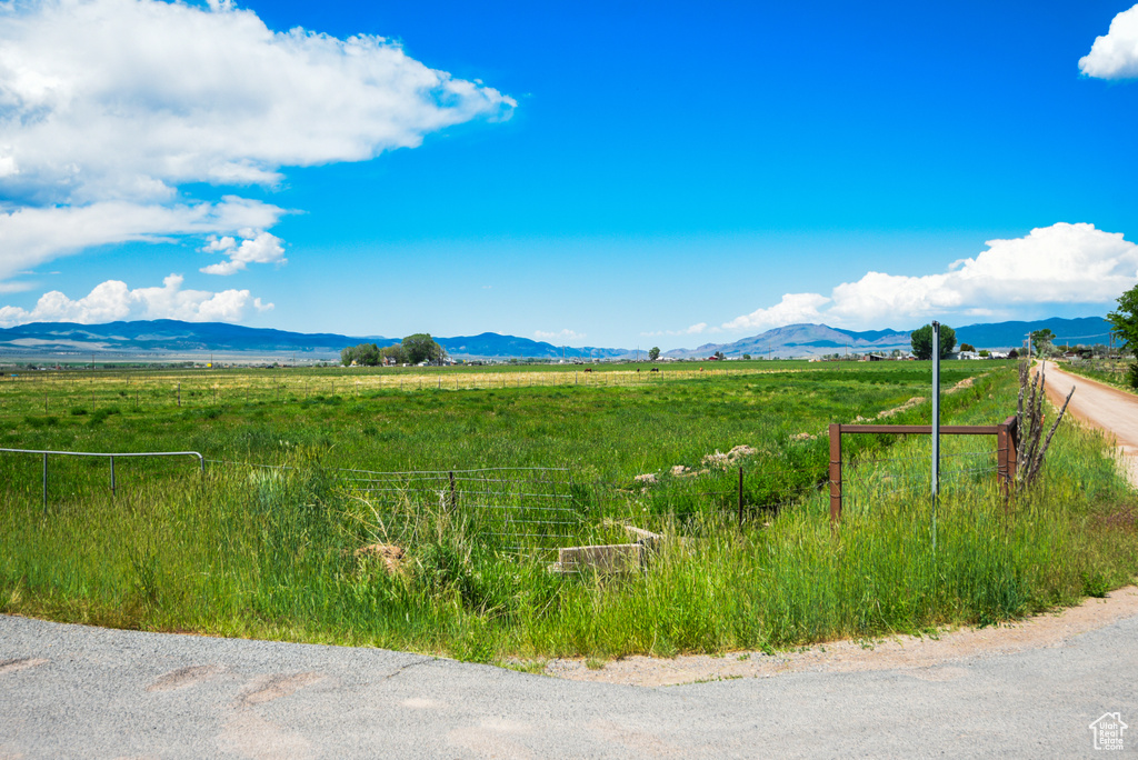 View of mountain backdrop with rural landscape