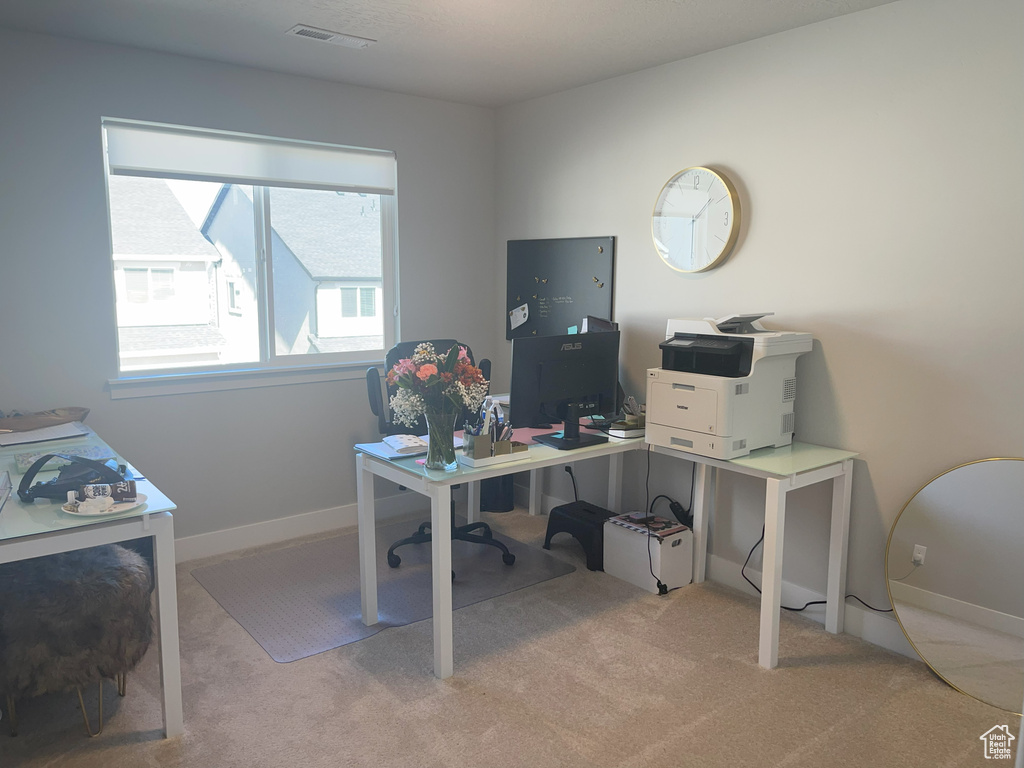 Office featuring carpet flooring, visible vents, and baseboards