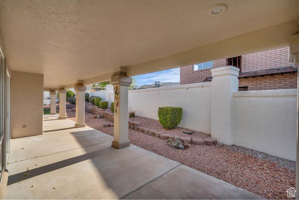 View of patio with fence