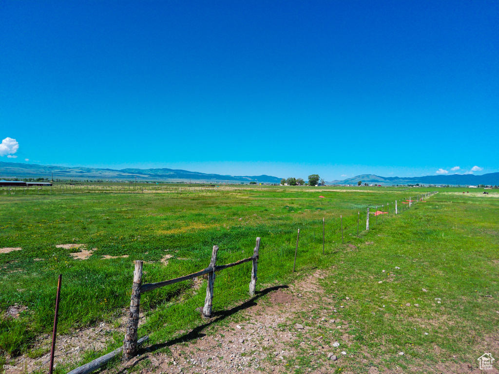 View of mountain backdrop featuring rural landscape and a pastoral area