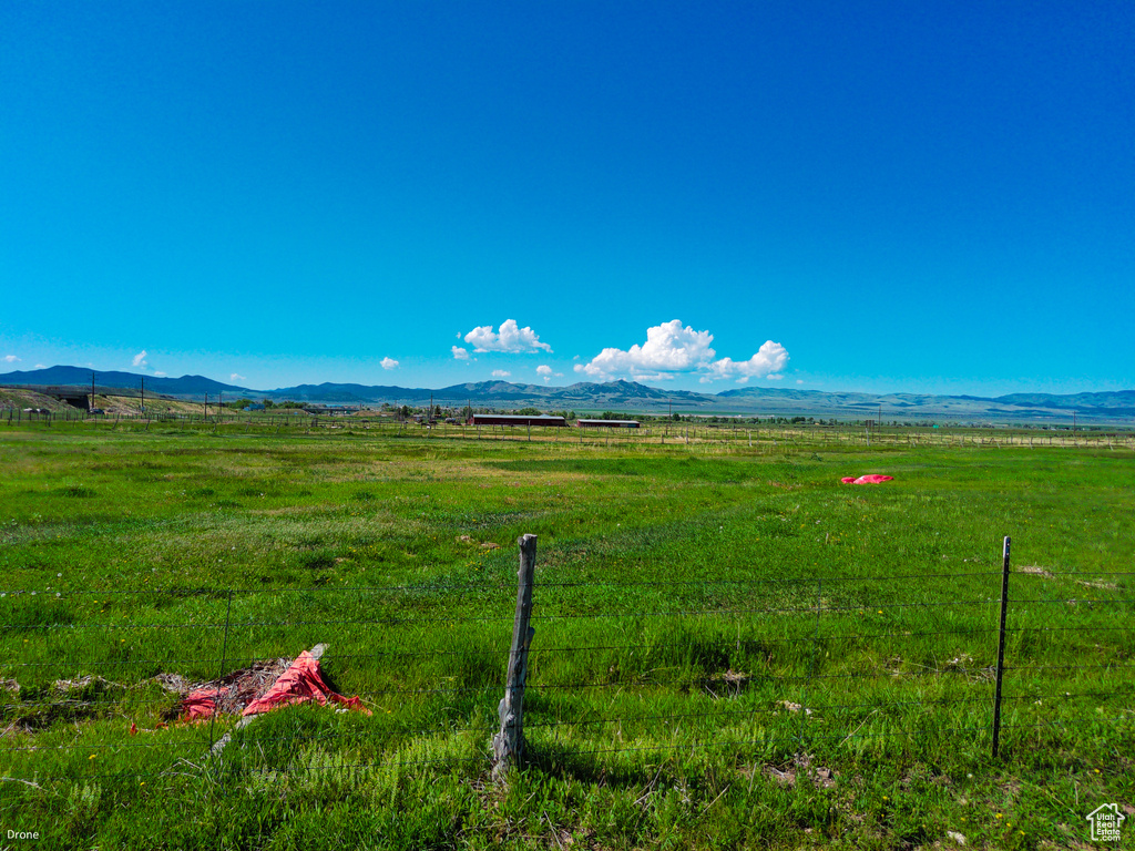 View of mountain backdrop with rural landscape and a pastoral area