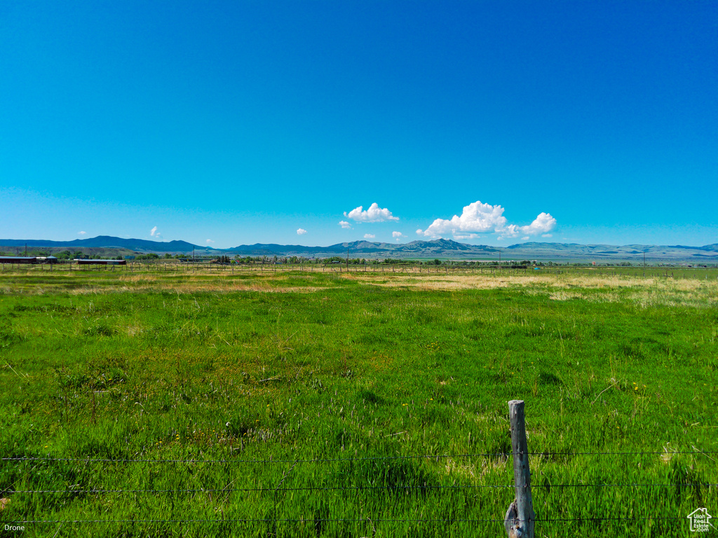 View of mountain backdrop featuring rural landscape