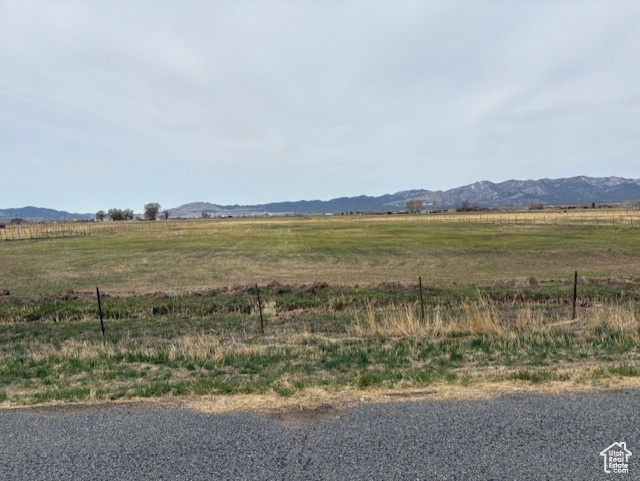 Property view of mountains with a rural view