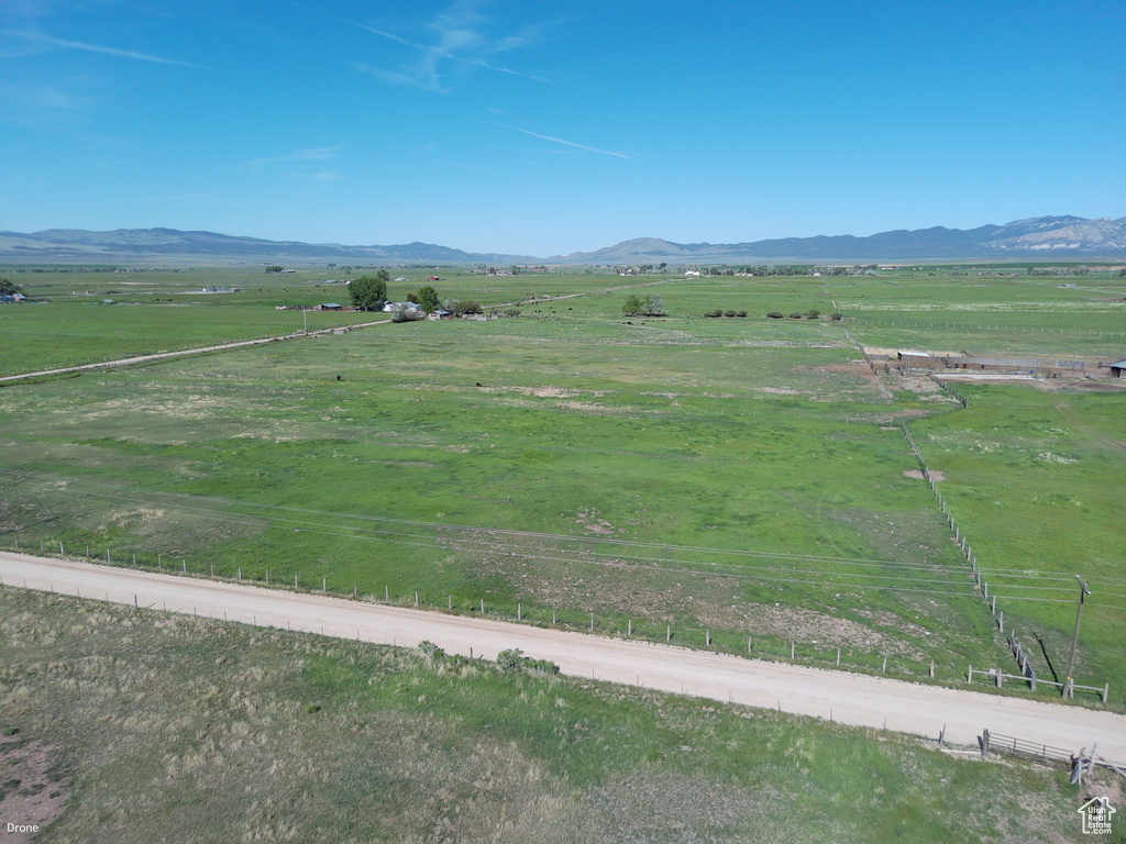 View of mountain backdrop featuring rural landscape and a pastoral area