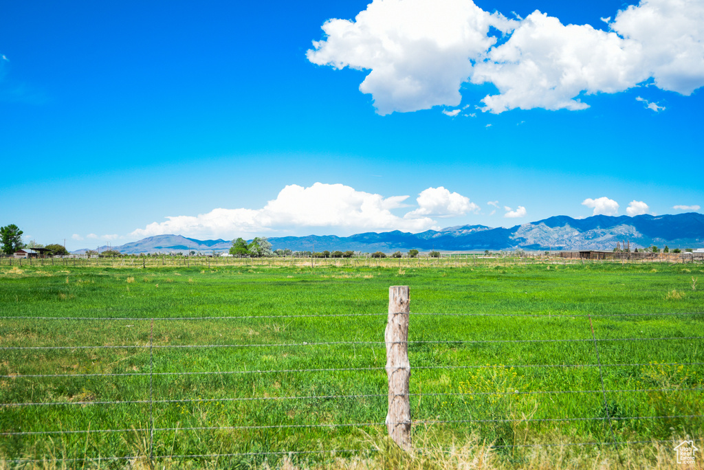 View of mountain background with rural landscape and agricultural land