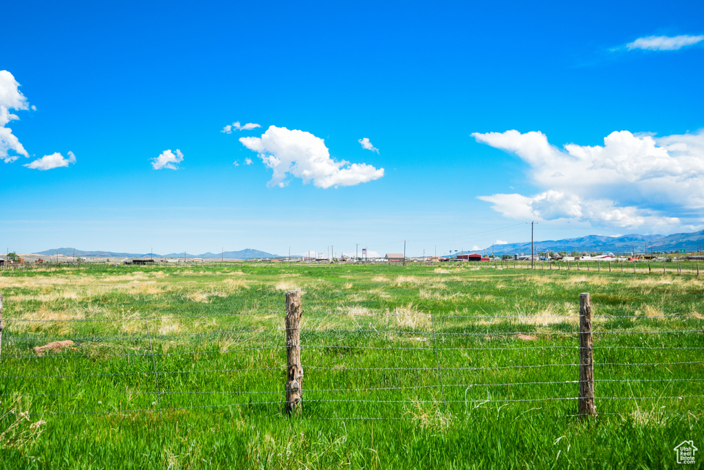 View of yard featuring a mountain view and a view of rural / pastoral area