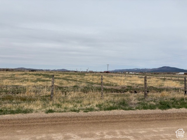 View of yard with a rural view