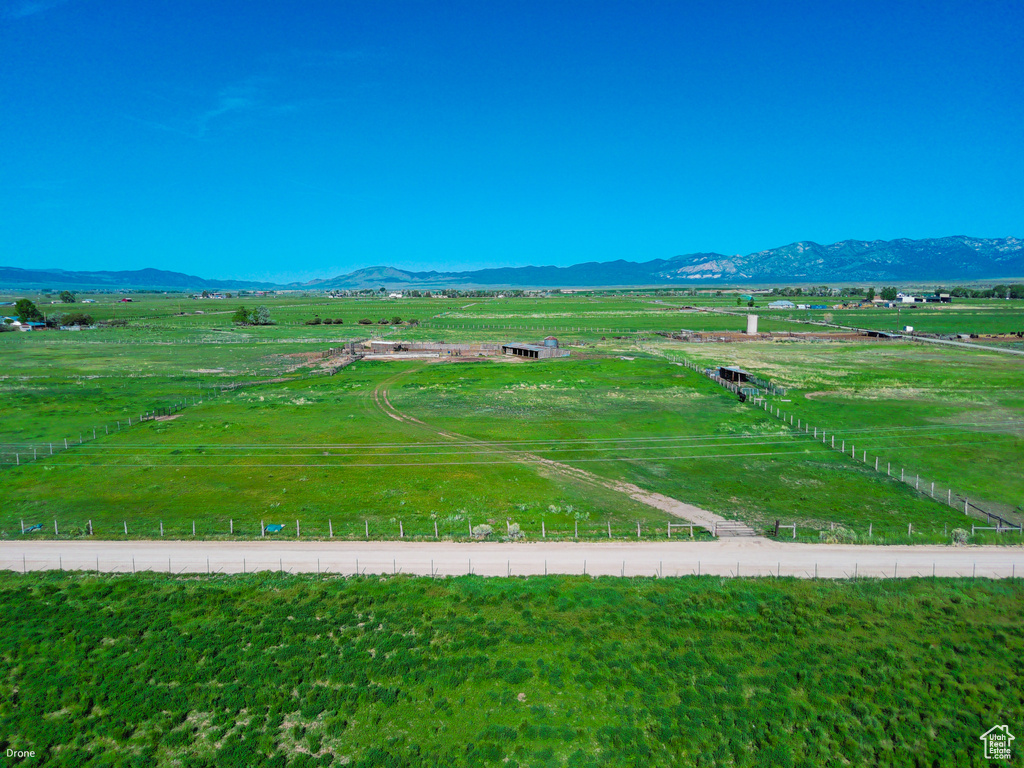 View of mountain backdrop featuring rural landscape and agricultural land