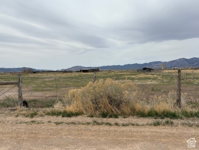 Property view of mountains with a rural view