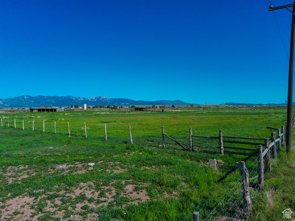 View of yard with a view of rural / pastoral area and a mountain view