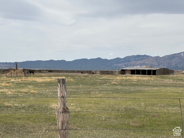 Property view of mountains featuring a rural view