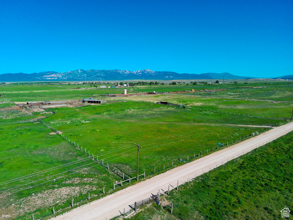 View of mountain backdrop featuring rural landscape and agricultural land