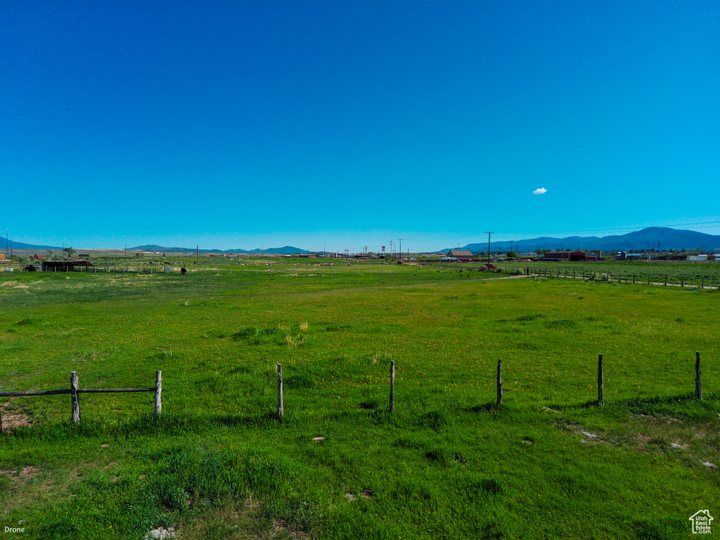 View of yard featuring a view of rural / pastoral area and a mountain view