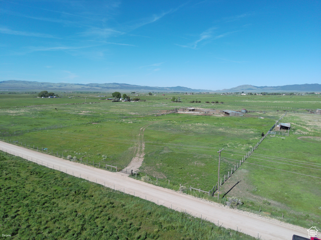 View of mountain backdrop featuring rural landscape and agricultural land