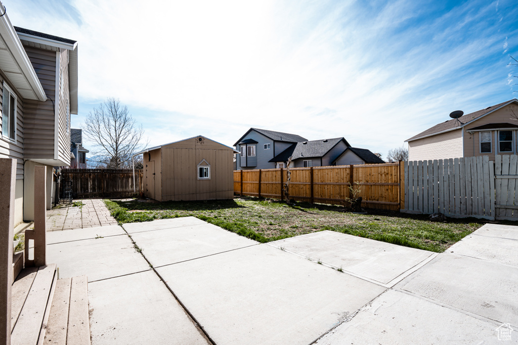 Fenced backyard featuring a patio