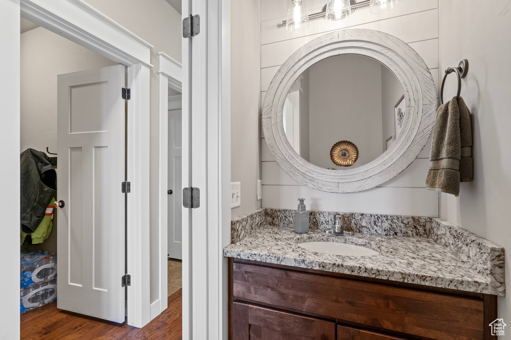Bathroom with vanity and wood finished floors