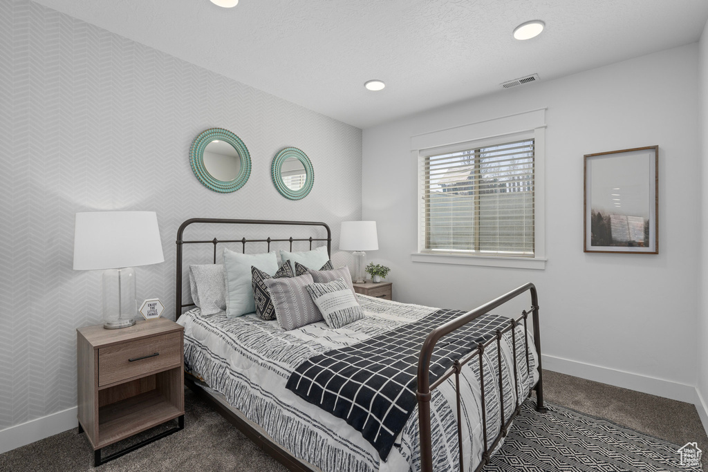 Bedroom featuring baseboards, wallpapered walls, recessed lighting, carpet flooring, and visible vents